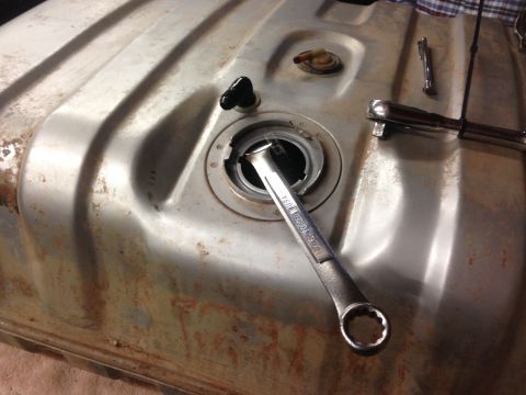 1979 Ford Bronco - Fuel tank with a wrench on the filler neck, likely during a repair or modification.