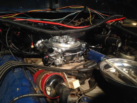 1979 Ford Bronco - The engine bay shows a newly installed Holley Sniper EFI system, with numerous wires and components visible.