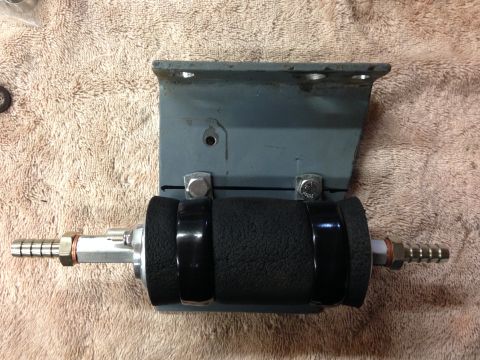 1979 Ford Bronco - Fuel pump assembly with black foam grip and metal bracket.