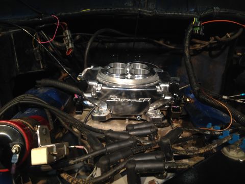 1979 Ford Bronco - Close-up of a Holley Sniper EFI unit installed in an engine bay.