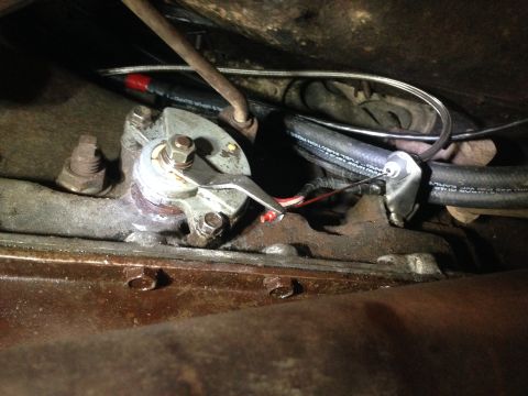 1979 Ford Bronco - Throttle linkage and fuel line detail, likely part of an engine modification.