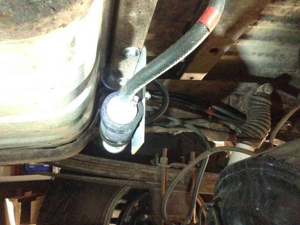 Fuel filter installation under vehicle chassis