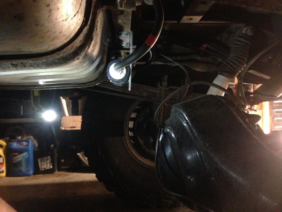 Underbody view of fuel filter installation on a vehicle