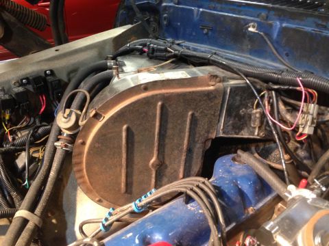 1979 Ford Bronco - Close-up of engine bay components, including the heater core assembly and associated wiring.
