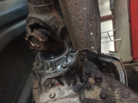 1982 Ford Bronco - This image shows the underside of a vehicle, focusing on the driveshaft and transfer case assembly.