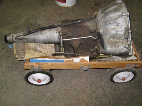 1968 Mercury Cougar - An automatic transmission is shown resting on a makeshift wooden cart.