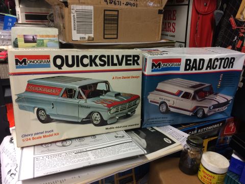 1989 Ford Bronco - Two model car kits, Monogram Quicksilver and Bad Actor, are displayed on a shelf with other hobby items.