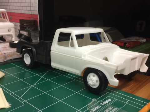 1989 Ford Bronco - Plastic model truck kit in progress, with another model visible in the background.
