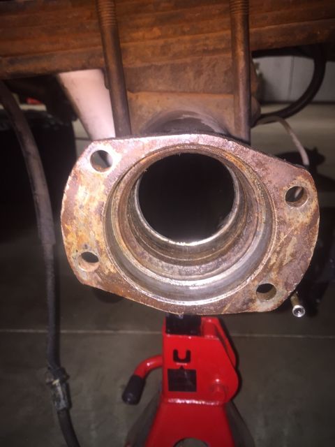 1982 Ford Bronco - Close-up of a rusted axle housing flange, likely from a vehicle's rear axle assembly.