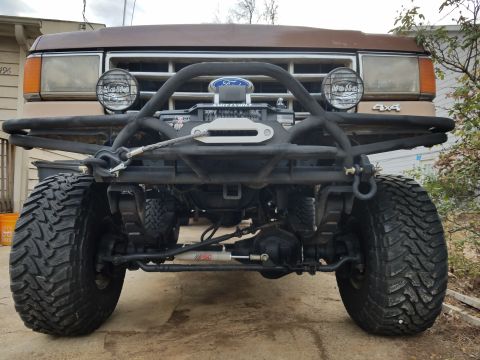 1988 Ford Bronco - Front view of a modified 1988 Ford Bronco a winch and heavy-duty bumper.