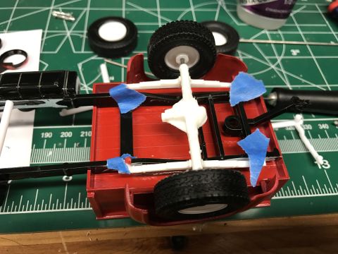 1989 Ford Bronco - This is a model car chassis being assembled, not a real vehicle.