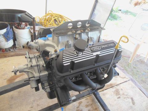 1984 Ford Bronco - Engine assembly with Ford Racing valve covers on a stand, ready for installation or work.