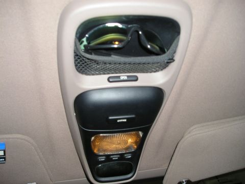 1996 Ford Bronco - Interior view of a vehicle's overhead console, showing a storage pocket for sunglasses and controls for a garage door opener.