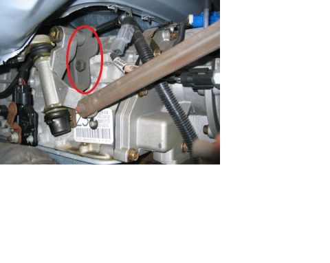 1992 Ford Bronco - Close-up of a transfer case component, possibly from a Ford Bronco, with a red circle highlighting a specific part.