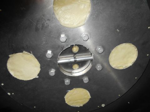 1992 Ford Bronco - Close-up view of a metal component with fasteners and openings, likely a vehicle part.
