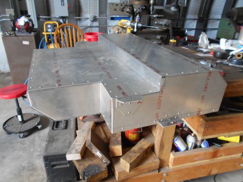 1992 Ford Bronco - A custom-fabricated aluminum box sits on a workbench, surrounded by tools and materials.
