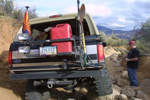 1996 Ford Bronco - Off-road Bronco equipped for adventure, a spare fuel can and tools for trail recovery.