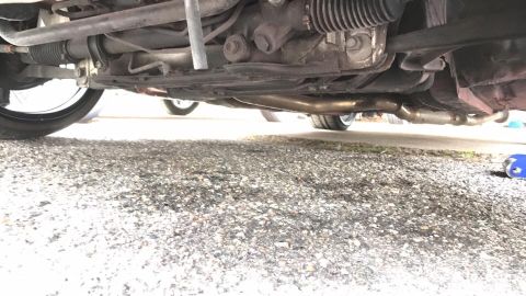1994 Toyota Supra - Undercarriage view of a vehicle, focusing on suspension and exhaust systems.