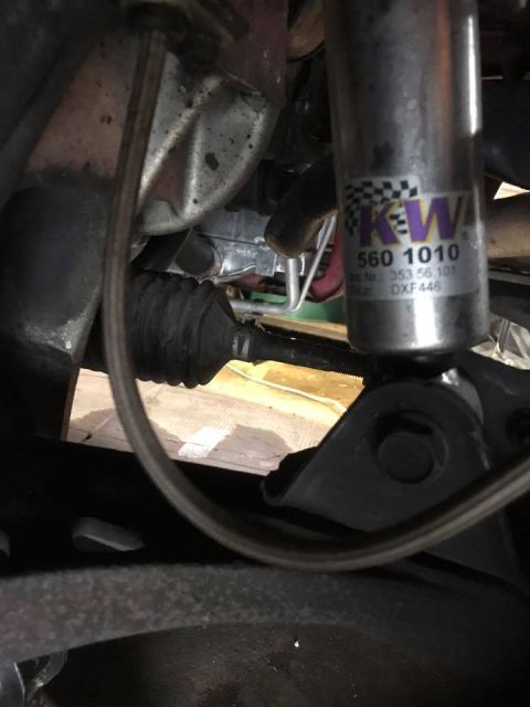 1994 Toyota Supra - A close-up view of a KW suspension shock absorber, showing part numbers and branding.