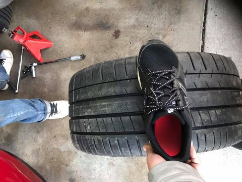 1994 Toyota Supra - Tires and a shoe are shown, with a jack and wrench in the background.