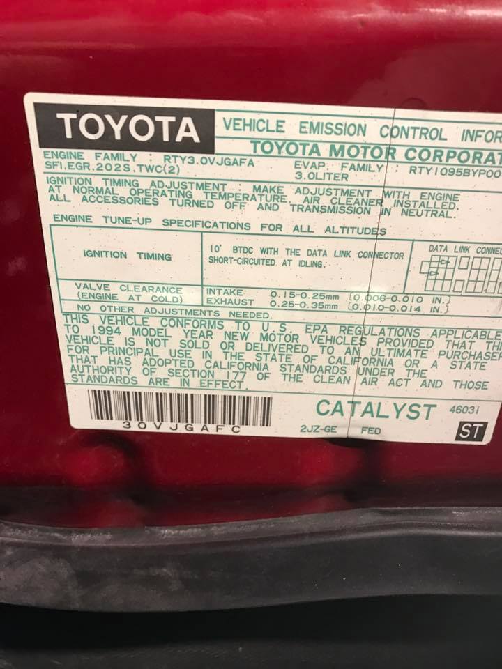 1994 Toyota emission sticker on red paint