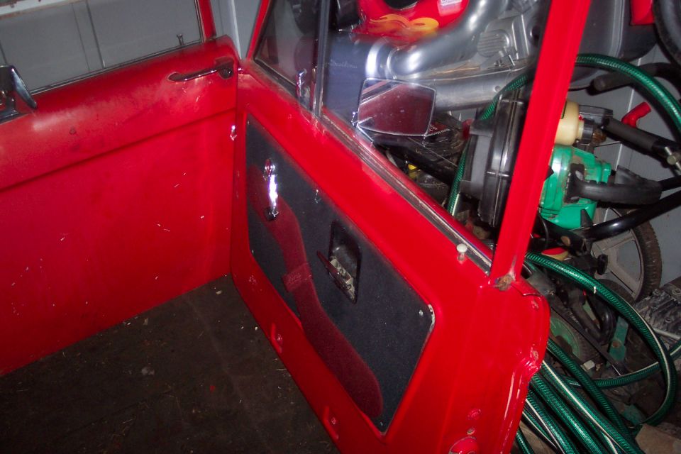 Red interior door panel with black insert and chrome handle