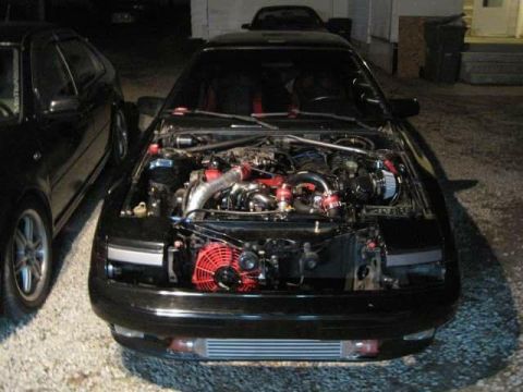1988 Toyota Celica - Modified engine bay of a 1988 Toyota Celica, showing aftermarket turbo and intercooler components.