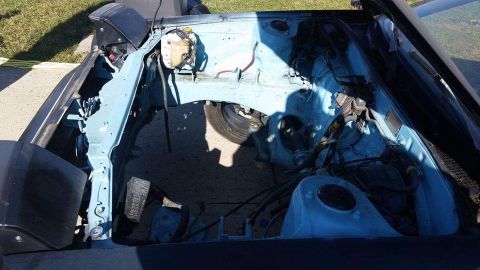 1988 Toyota Celica - The engine bay of a 1988 Toyota Celica, stripped down to bare metal.