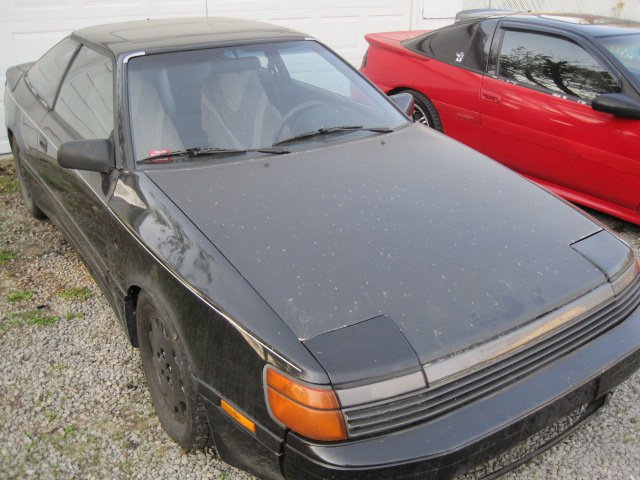 Black 1988 Toyota Celica coupe with pop-up headlights