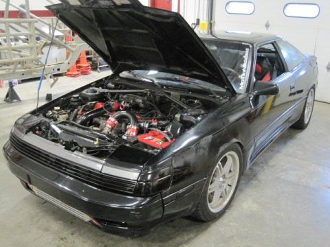 1988 Toyota Celica - This 1988 Toyota Celica has its hood open, revealing its engine bay and some modifications.