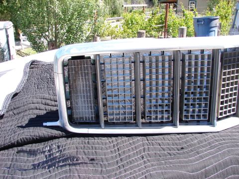 1973 Ford Ranchero - A close-up view of a vehicle's front grille, showing its intricate design and material.