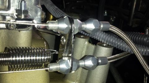 1976 Ford Ranchero - Throttle linkage and carburetor assembly, likely from an older vehicle's engine bay.