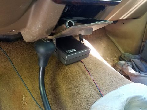 1988 Ford Bronco - The interior of a 1988 Ford Bronco shows a shifter and a CB radio mounted on the dashboard.