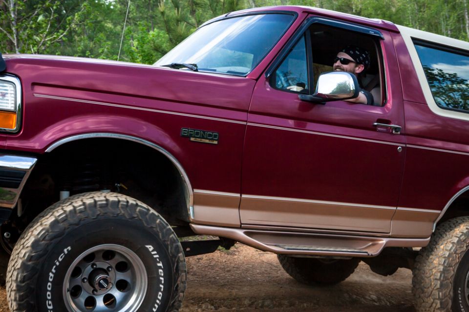 Maroon 1995 Ford Bronco 3q-front view with driver