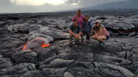 1996 Ford Bronco - A group of friends visits a volcanic landscape a flowing lava stream.
