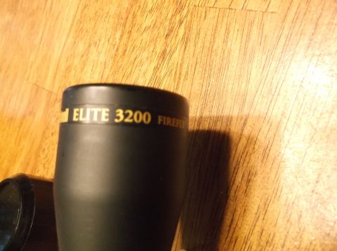 1995 Mercury Grand Marquis - A close-up view of a rifle scope with visible branding and model information.