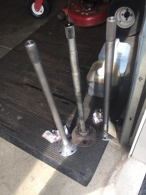 1982 Ford Bronco - Three axle shafts are shown, likely for a vehicle repair or upgrade project.
