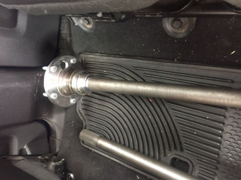 Axle shaft and hub assembly inside a vehicle