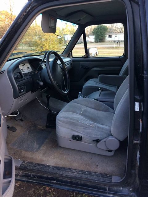 1996 Ford Bronco - Interior view of a truck, showing the driver's side seat and dashboard.