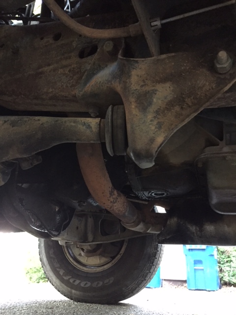 1996 Ford Bronco - Undercarriage view of a 1996 Ford Bronco, highlighting suspension components and exhaust system.
