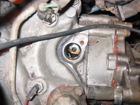 1989 Ford Bronco - Oil pump driveshaft is in the middle...a dropped socket might be disastrous, so be careful and tape the crap out of it to the extension.