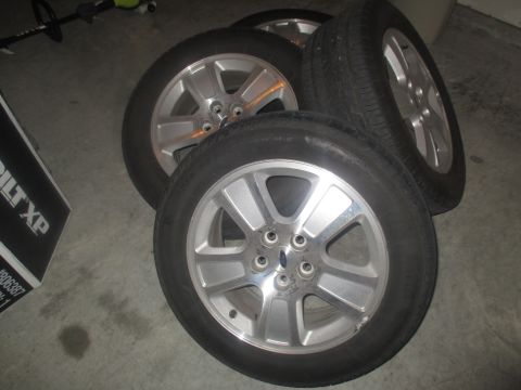 2004 Ford Crown Victoria - 2 235/55/17 Pirelli tires, that will need replacing