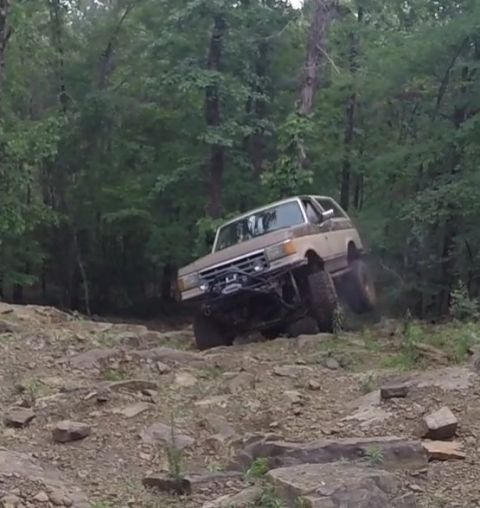 1988 Ford Bronco - This modified Ford Bronco navigates a challenging off-road course.