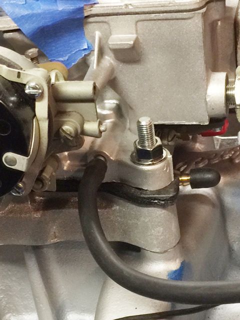 1978 Ford Bronco - Detail of a vehicle's engine, focusing on the carburetor and associated hoses and fittings.