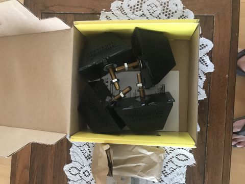 1997 Dodge 3500 - Box of four rubber bump stops with hardware, part number visible on the items.