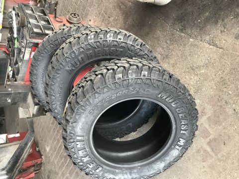 1996 Ford Bronco - A set of Mud Beast MT tires are shown, with size information visible on the sidewall.