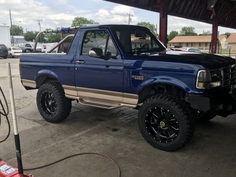 1996 Ford Bronco - This 1996 Ford Bronco features a two-tone paint scheme and custom wheels.
