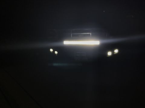 1996 Ford Bronco - Front view of a vehicle's bumper equipped with an aftermarket light bar and headlights.
