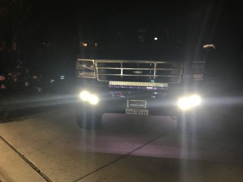 1996 Ford Bronco - Front view of a 1992 Ford F-Series truck at night, equipped with a light bar and fog lights.