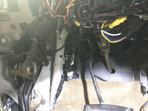 1996 Ford Bronco - Wiring harness and components visible under the dashboard of a 1996 Ford Bronco.